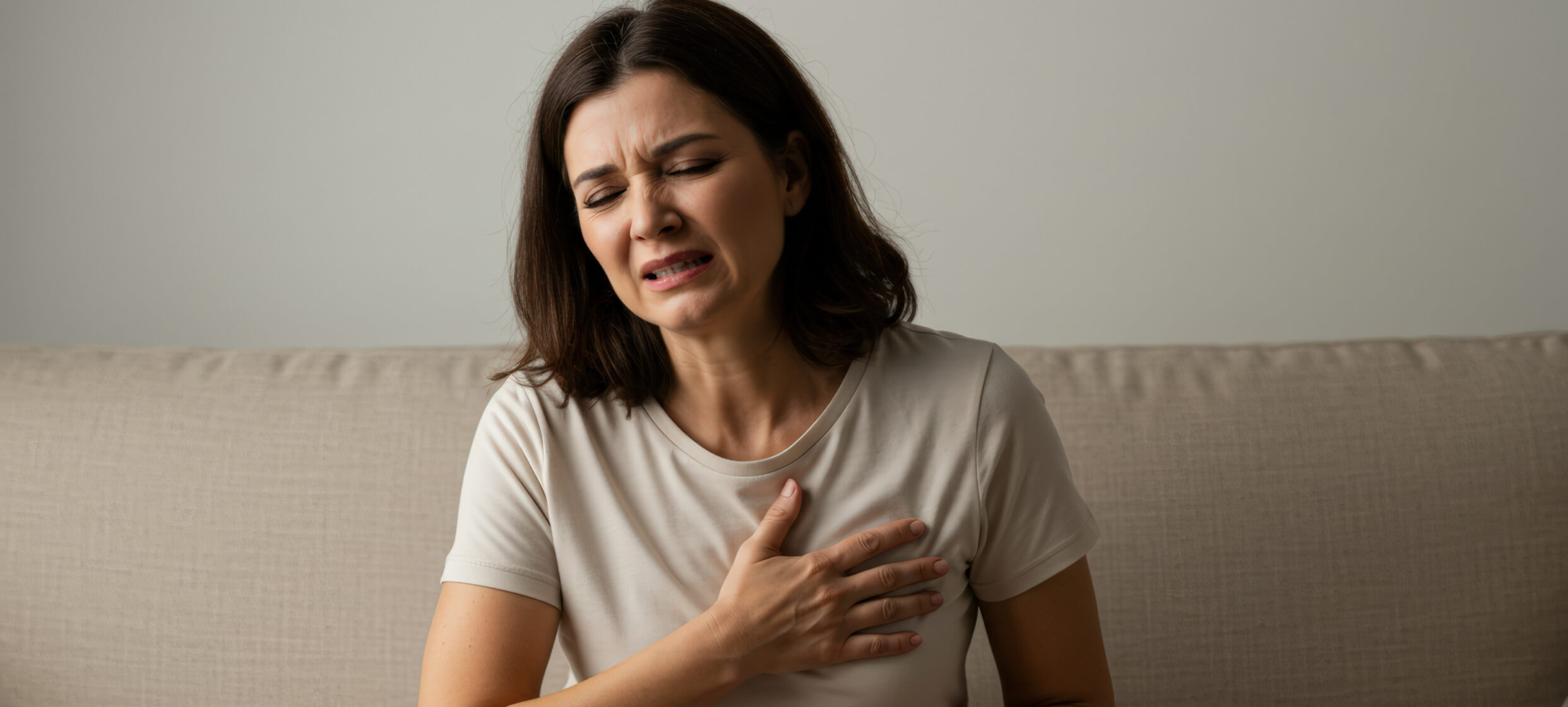 Woman experiencing symptoms of a heart attack