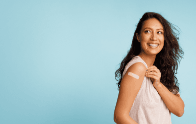 Woman with a bandage on her upper arm.